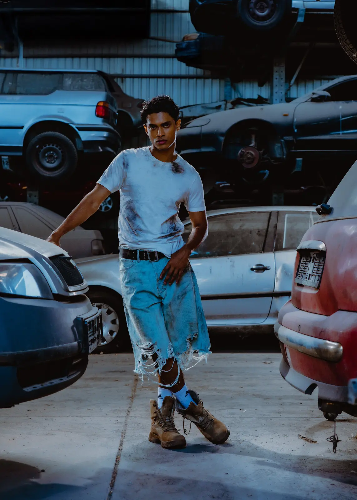 Person standing among several vehicles