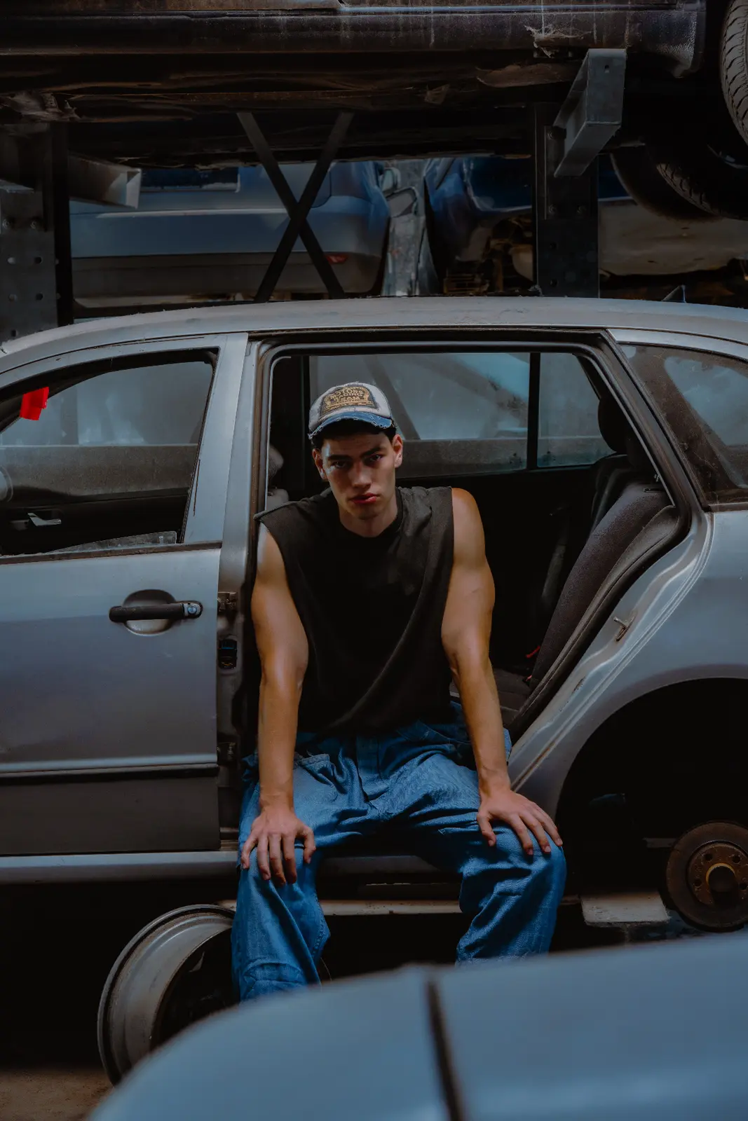 Traveler seated beside an open vehicle door